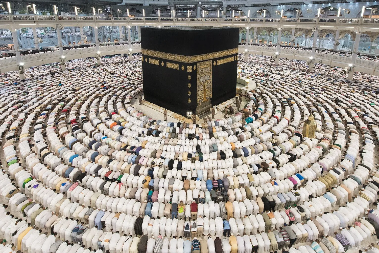 Pilgrims praying in rows around the Kaaba in Masjid al-Haram