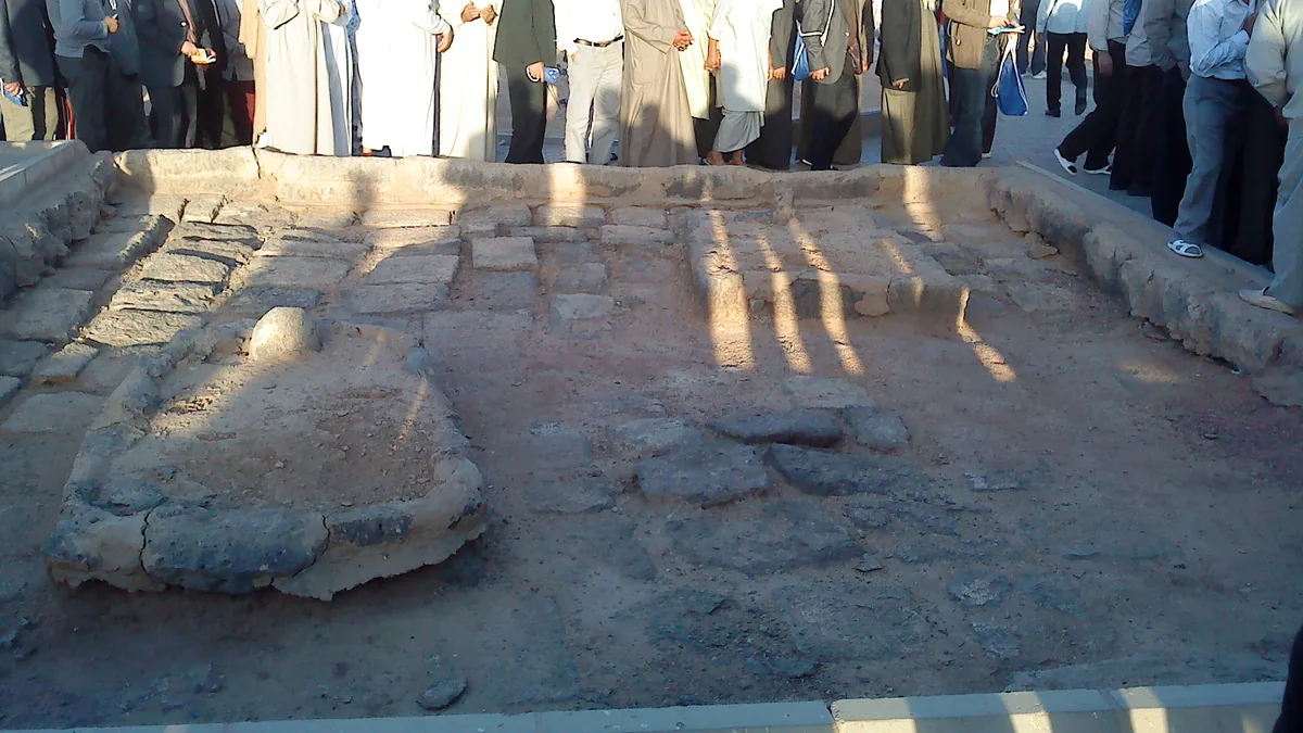 Grave markers and low boundaries at Jannat ul Baqi cemetery