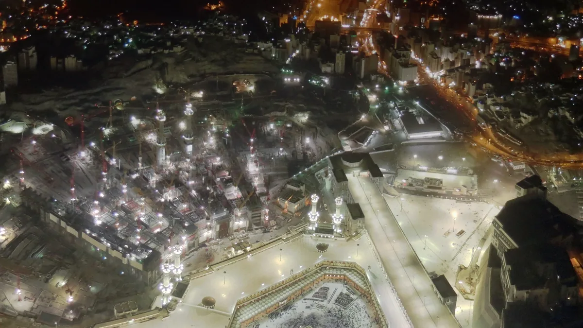 Masjid al-Haram lit up at night, seen from above