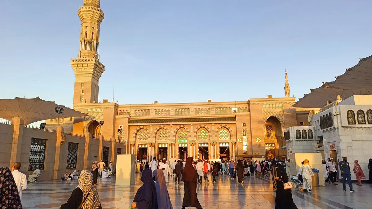 Pilgrims in the courtyard of Masjid an-Nabawi in the late afternoon