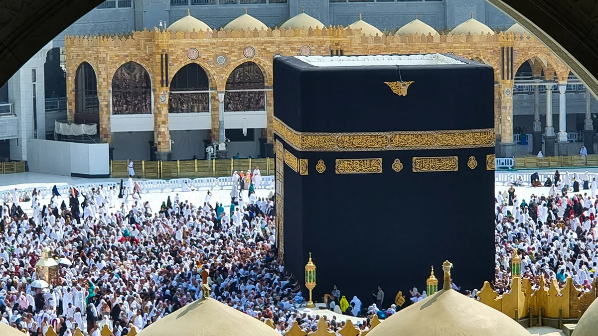 The Kaaba and the Tawaf crowd seen from the second floor of Masjid al-Haram