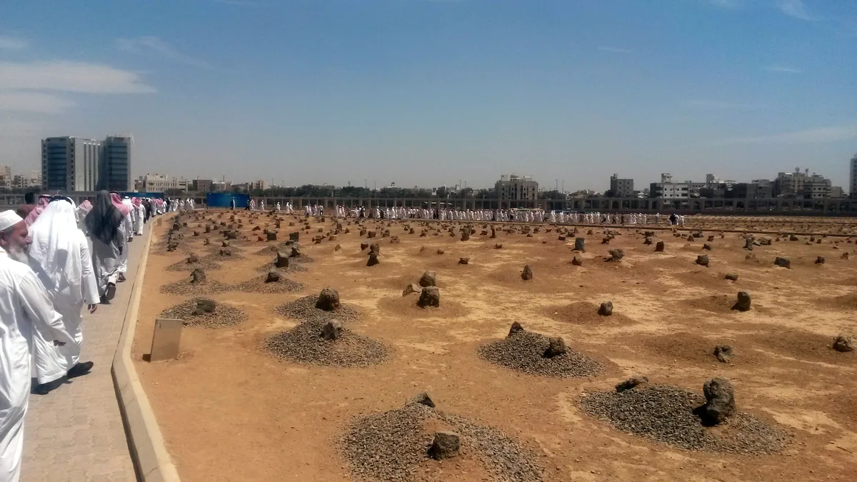 Visitors on the path through Jannat al-Baqi